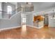 Open floorplan view of foyer, stairs, and the kitchen beyond at 3085 Woodbridge Ln, Canton, GA 30114