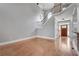 Spacious foyer with staircase and hardwood floors leading into the home at 3085 Woodbridge Ln, Canton, GA 30114