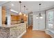 Open kitchen with breakfast bar and granite countertops at 3085 Woodbridge Ln, Canton, GA 30114