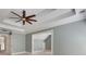 Neutral room with high ceilings and a ceiling fan; a versatile space ready for décor at 3085 Woodbridge Ln, Canton, GA 30114