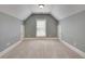 Bright room featuring neutral walls and plush carpet, offering a blank canvas at 3085 Woodbridge Ln, Canton, GA 30114