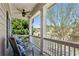 Charming front porch with rocking chairs and lush greenery at 1749 Grand Oaks Dr, Woodstock, GA 30188
