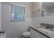 Tiled bathroom with granite countertops, offering a clean and modern aesthetic at 2038 Thomasville Se Dr, Atlanta, GA 30315