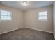A bright bedroom with two windows and soft carpeting at 2038 Thomasville Se Dr, Atlanta, GA 30315