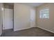 Inviting bedroom with neutral carpeting, ample natural light, and plenty of space at 2038 Thomasville Se Dr, Atlanta, GA 30315