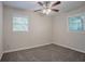 Airy bedroom with a ceiling fan and two windows, offering comfort and light at 2038 Thomasville Se Dr, Atlanta, GA 30315