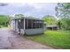 View of home showing screened porch and lush, green lawn at 2038 Thomasville Se Dr, Atlanta, GA 30315