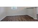 Spacious room featuring wood flooring and neutral paint, creating a bright atmosphere at 2038 Thomasville Se Dr, Atlanta, GA 30315
