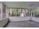 Relax in this screened porch with backyard view and updated flooring at 2038 Thomasville Se Dr, Atlanta, GA 30315