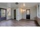 Bright sunroom with wood flooring and two access doors at 2038 Thomasville Se Dr, Atlanta, GA 30315