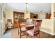 The dining area has hardwood floors and is adjacent to the kitchen at 2480 Sheldon Pl, Cumming, GA 30040