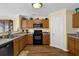 Well-maintained kitchen featuring light wood cabinets and modern appliances at 2480 Sheldon Pl, Cumming, GA 30040