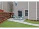 Charming backyard patio with seating and well-maintained lawn, great for outdoor dining and relaxation at 2480 Sheldon Pl, Cumming, GA 30040