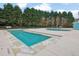Community swimming pool featuring a lap pool and wading area, surrounded by lush landscaping at 2480 Sheldon Pl, Cumming, GA 30040