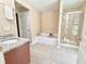 Bright bathroom featuring a shower, soaking tub, and granite counter tops at 3546 Flycatcher Way, Duluth, GA 30097