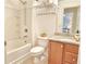 Clean bathroom with a shower-tub combination, tile surround, and granite-topped vanity at 3546 Flycatcher Way, Duluth, GA 30097