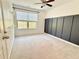 Neutral bedroom with large window, modern wainscoting, and ceiling fan at 3546 Flycatcher Way, Duluth, GA 30097