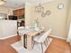 Bright dining area featuring stylish table setting and modern lighting fixture at 3546 Flycatcher Way, Duluth, GA 30097