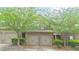 Charming brick townhome featuring a two-car garage and mature trees enhancing its curb appeal at 3546 Flycatcher Way, Duluth, GA 30097