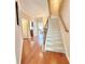 Inviting foyer with gleaming hardwood floors and a staircase leading to the upper level at 3546 Flycatcher Way, Duluth, GA 30097
