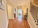 Welcoming foyer with hardwood floors, staircase, and views into the adjoining living spaces at 3546 Flycatcher Way, Duluth, GA 30097
