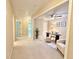 Carpeted hallway with access to multiple rooms and a home office at 3546 Flycatcher Way, Duluth, GA 30097