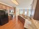 Well-equipped kitchen with granite countertops, stainless steel appliances, and hardwood floors at 3546 Flycatcher Way, Duluth, GA 30097