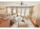 Bright and airy living room with hardwood floors, neutral decor, and large windows at 3546 Flycatcher Way, Duluth, GA 30097