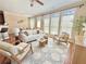 Cozy living room with hardwood floors, stylish decor, and large windows at 3546 Flycatcher Way, Duluth, GA 30097