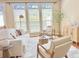 Bright living room with large windows, neutral decor, and stylish furniture at 3546 Flycatcher Way, Duluth, GA 30097