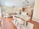 Open concept living room and dining area featuring hardwood floors and modern furnishings at 3546 Flycatcher Way, Duluth, GA 30097