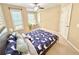 Stylish main bedroom featuring statement wallpaper, study space, and ceiling fan at 3546 Flycatcher Way, Duluth, GA 30097