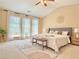 Bright main bedroom with high ceilings, sitting area, and many windows at 3546 Flycatcher Way, Duluth, GA 30097