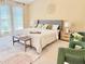 Bright main bedroom with high ceilings, sitting area, and many windows at 3546 Flycatcher Way, Duluth, GA 30097
