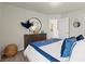 Relax in this bedroom featuring a stylish dresser, mirror, and comfortable decor at 847 Pensive Run, Dacula, GA 30019