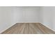 A standard empty bedroom with light wood-look floors, ready for personalization and decor at 847 Pensive Run, Dacula, GA 30019