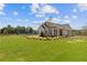 A clubhouse features a lush green lawn, a playground, and yellow landscaping at 847 Pensive Run, Dacula, GA 30019