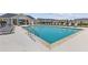 A pristine community pool offers a refreshing retreat with plenty of lounge chairs and umbrellas at 847 Pensive Run, Dacula, GA 30019