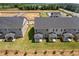 Overhead view of new townhomes, showcasing backyard patios and landscaping at 847 Pensive Run, Dacula, GA 30019