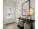 Cozy foyer with a stylish console table, lamps, and decorative art at 847 Pensive Run, Dacula, GA 30019
