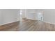 Hallway featuring wood-look flooring and neutral wall color, leading to various rooms at 847 Pensive Run, Dacula, GA 30019