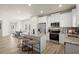 Modern kitchen featuring stainless steel appliances, granite countertops, and a center island with seating at 847 Pensive Run, Dacula, GA 30019