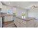 Well-lit kitchen with a large island and modern appliances at 847 Pensive Run, Dacula, GA 30019