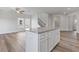 Kitchen island with granite countertops and shaker style cabinets at 847 Pensive Run, Dacula, GA 30019