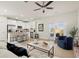 Open-concept living room flowing into a kitchen with bar seating and natural light at 847 Pensive Run, Dacula, GA 30019