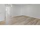 Comfortable living area featuring wood-look flooring, with natural light and neutral wall color at 847 Pensive Run, Dacula, GA 30019