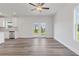 Open concept living area leading to the backyard with hardwood floors at 847 Pensive Run, Dacula, GA 30019