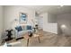 Comfortable upstairs sitting area featuring neutral tones, natural light and modern decor at 847 Pensive Run, Dacula, GA 30019