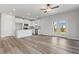 Open concept floor plan with kitchen, dining, and living room with hardwood floors at 847 Pensive Run, Dacula, GA 30019