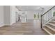 Open floor plan featuring a staircase and hardwood floors at 847 Pensive Run, Dacula, GA 30019